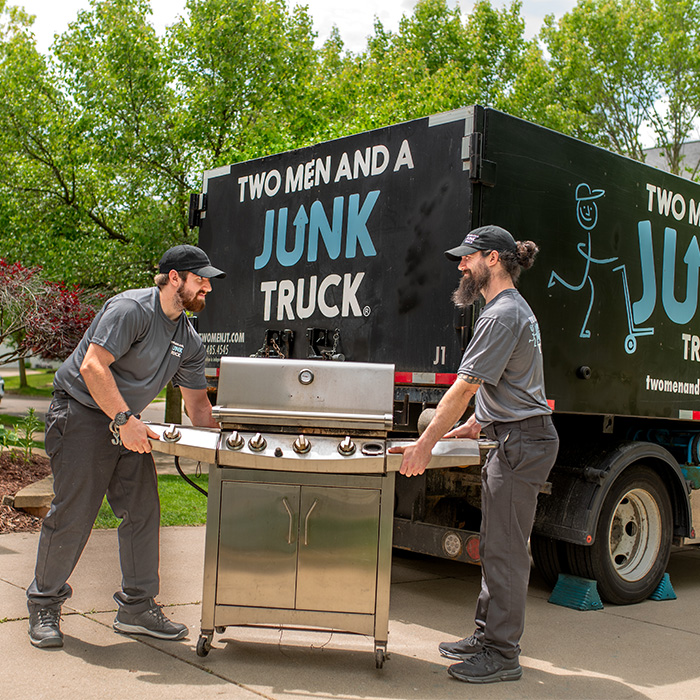 old appliance getting removed by junk haulers