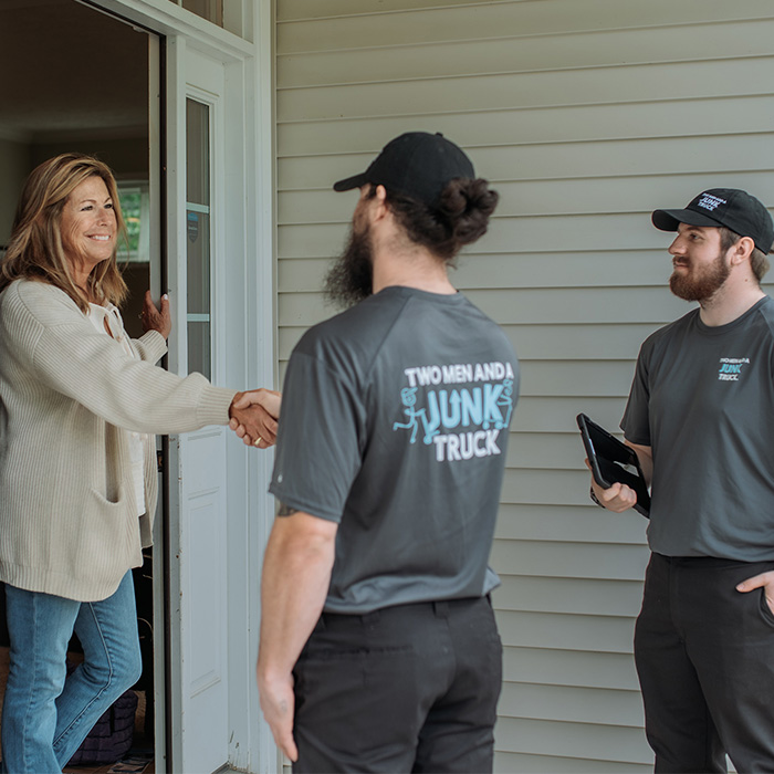 TMJT Junk Haulers shaking customers hand