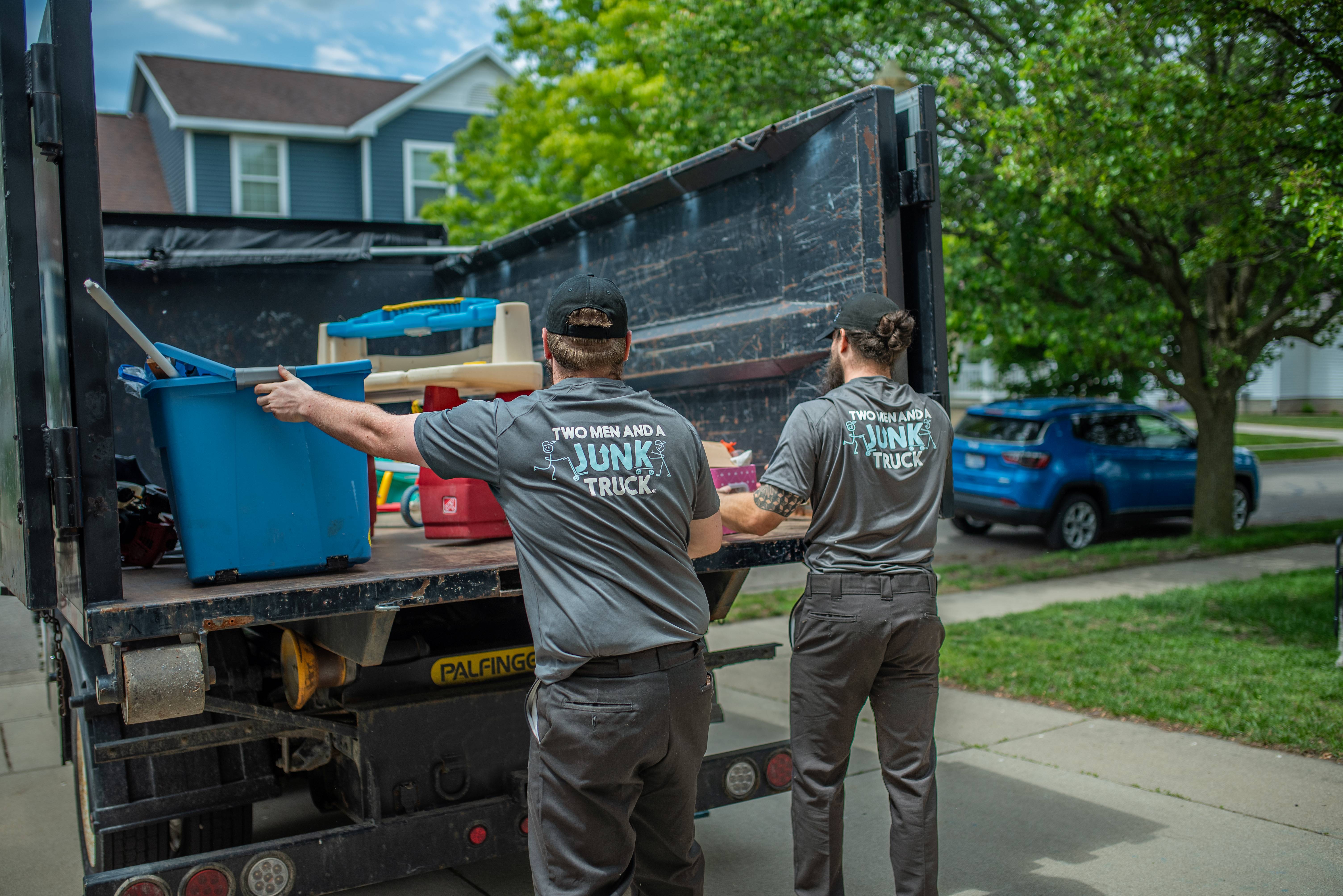 Junk Haulers loading items into the truck