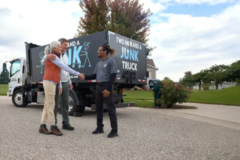 Junk hauler shaking customers hands
