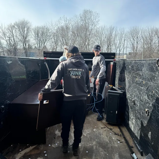 TMJT Haulers loading up lots of old living room and home office furniture