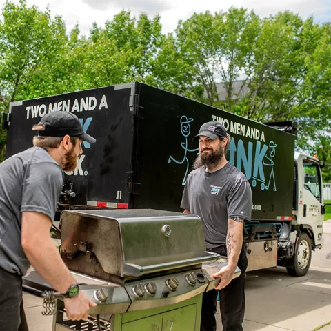 old appliance getting removed by junk haulers