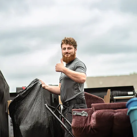 junk haulers removing trash from a customer home