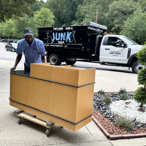 Team Member Hauling Office Furniture