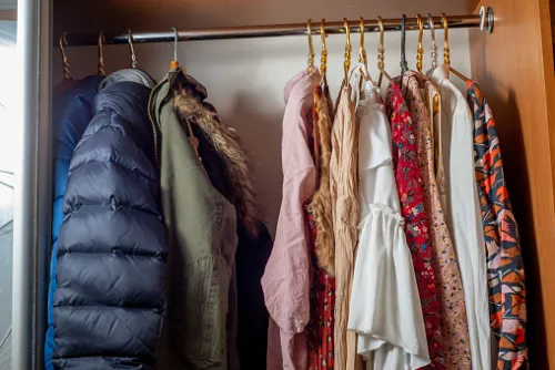 A closet that has been organized and decluttered