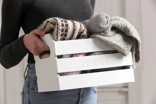 Removing unwanted clothing items and donating to charity
