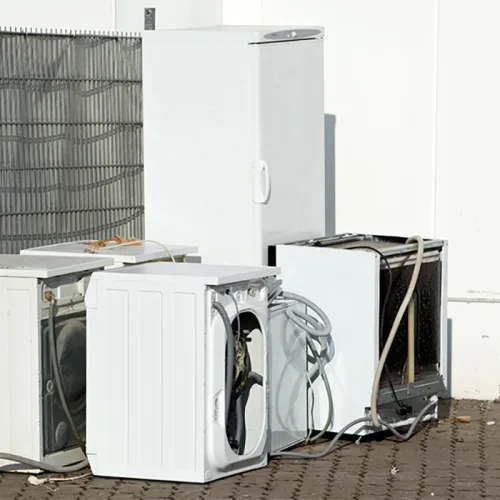 old refrigerator that needs a junk removal company haul away service