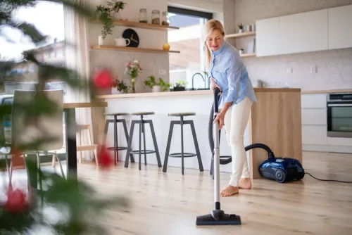 cleaning up the kitchen floor with cleaning supplies