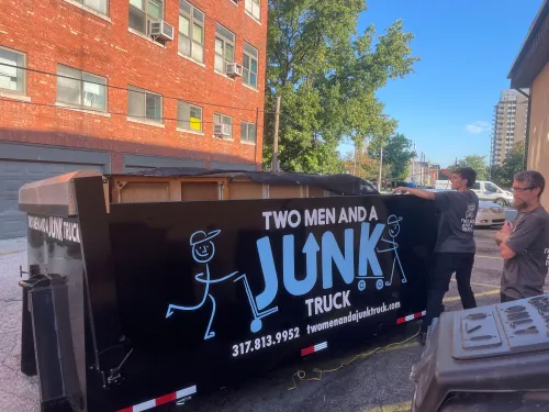 Junk Truck bed being loaded