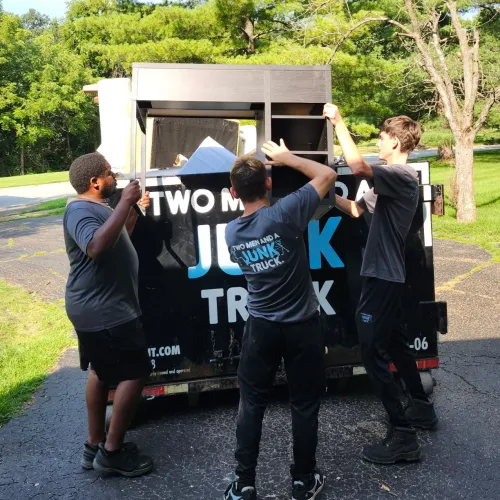 Junk Haulers loading up a truck