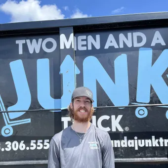 two men and junk truck davenport manager picture carter