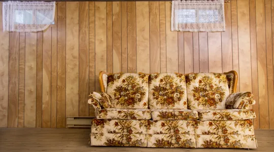 An old, outdated couch that needs to be removed to create space for opportunity