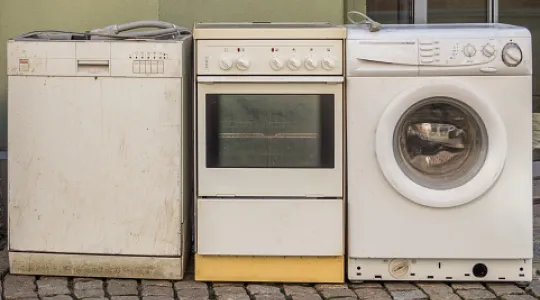 An old dishwasher, oven and washing machine