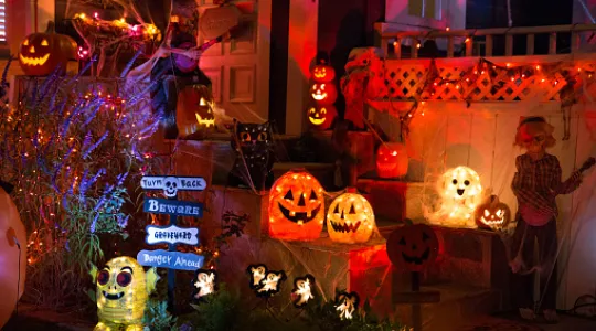 A colorful electronic Halloween display on a front porch