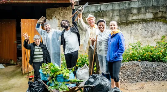 A group of people cleaning up an alley in their neighborhood