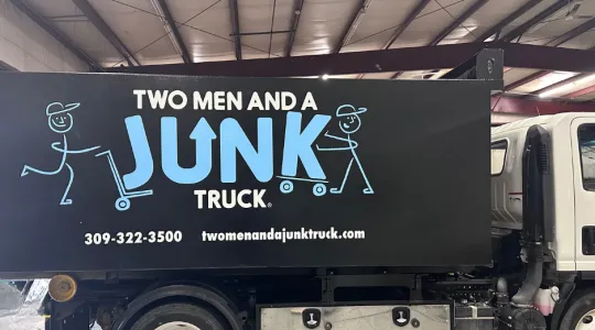 two men and a junk truck in peoria